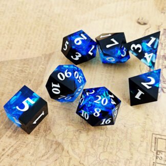 black and blue resin dice with white numbers