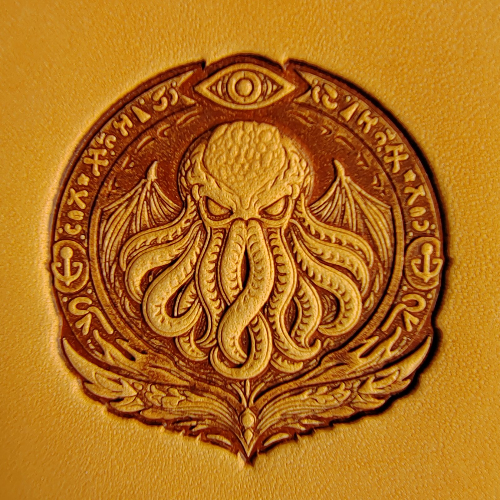 Close-up of Cthulhu embossing on leather